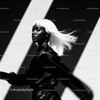 Confident woman with platinum hair in dynamic movement