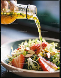 Fresh salad with strawberries and vinaigrette dressing