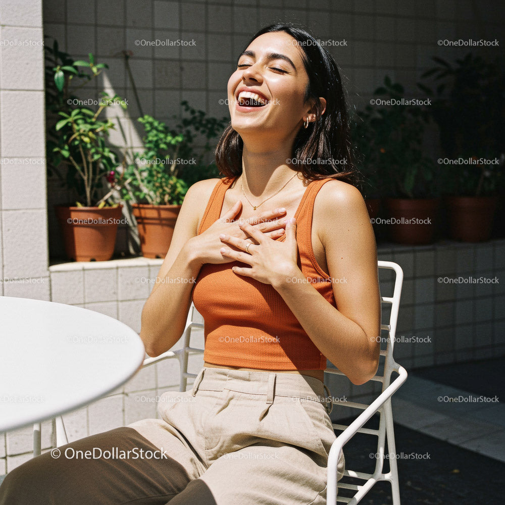 Joyful Woman Laughing in a Bright Outdoor Setting