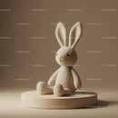 Soft plush bunny toy sitting on beige pedestal
