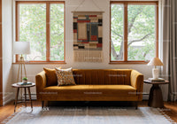 Cozy living room with mustard velvet sofa and natural light