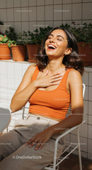 Happy Woman Laughing Relaxing Outdoors in Casual Clothing