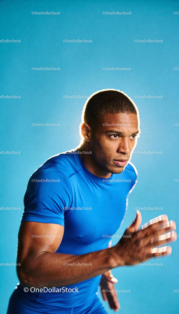 Focused young athlete sprinting with intense determination