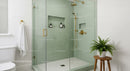 Modern bathroom with glass shower and gold fixtures