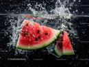 Fresh Watermelon Slices Splashing into Water on Dark Background