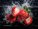Fresh Strawberries Splashing in Water with Vibrant Red Color
