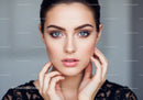 Close-Up of a Woman with Blue Eyes and Perfect Skin in Beauty Portrait