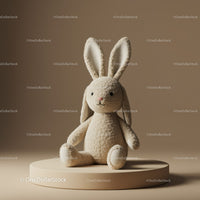 Soft plush bunny toy sitting on beige pedestal