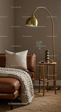 Cozy living room corner with leather sofa and warm lighting