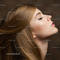 Profile of young woman with flowing blonde hair