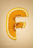 Fresh orange slice shaped like letter F with water drops