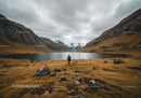 Scenic Mountain Valley with Lake and Hiker under Cloudy Sky