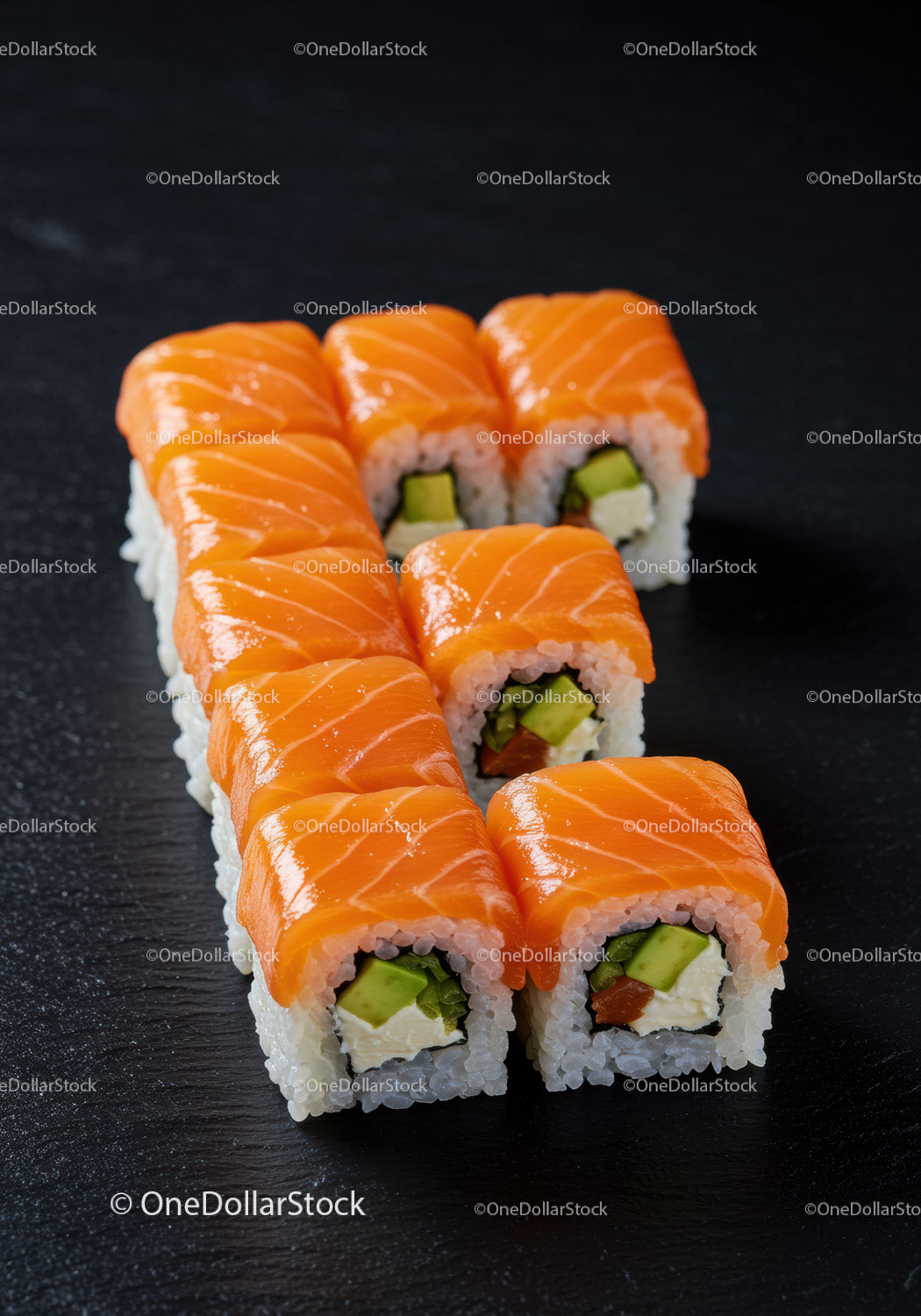 Fresh salmon sushi rolls with avocado and cream cheese