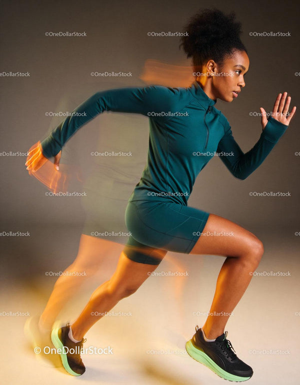 Focused young athlete sprinting with dynamic motion blur