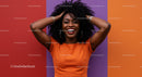 Vibrant black woman with curly hair smiling in colorful background