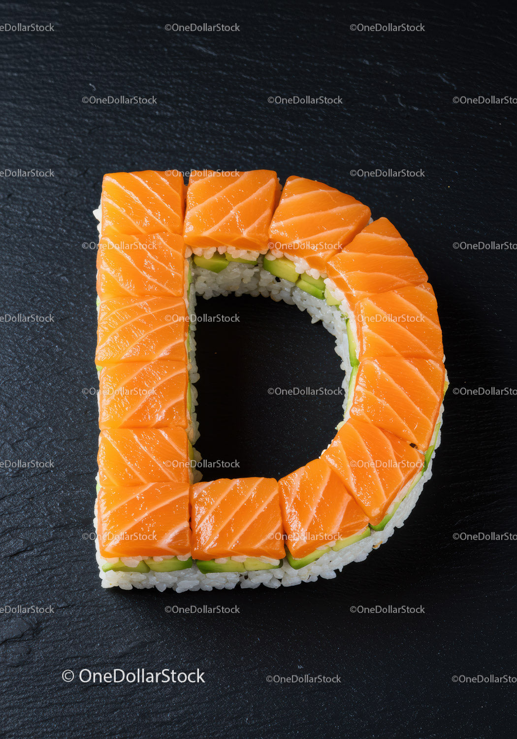 Letter D shaped sushi with fresh salmon slices