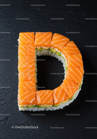 Letter D shaped sushi with fresh salmon slices