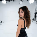 Stylish Young Woman in Black Dress Posing in Studio with Professional Lighting
