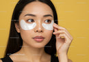 Young Woman Applying Eye Patches for Skincare Routine
