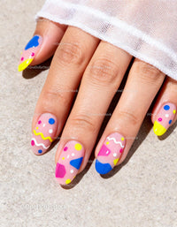 Colorful geometric nail art on natural nails
