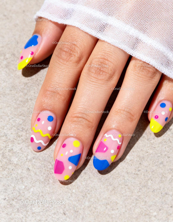 Colorful geometric nail art on natural nails