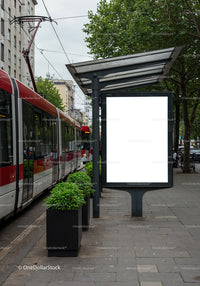 Modern tram station with blank advertising display