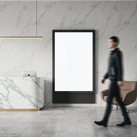 Modern marble reception area with blank digital display