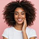 Portrait of a Happy Young Woman with Curly Hair and Bright Smile