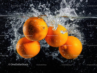 Vibrant Oranges Splashing into Water Creating Juicy Refreshing Scene
