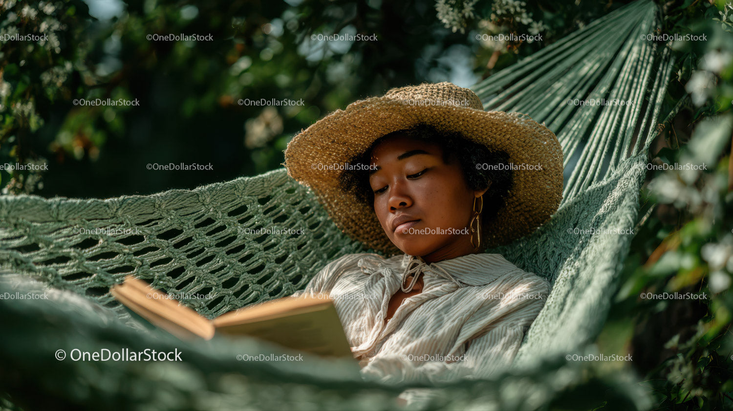 Woman Relaxing in Hammock Reading Book in Tropical Garden