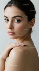 Close-Up Portrait of a Beautiful Young Woman with Natural Makeup and Brown Hair
