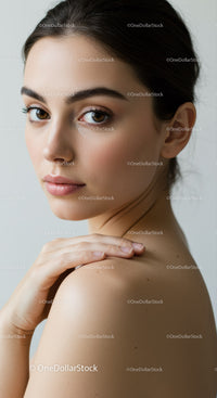 Close-Up Portrait of a Beautiful Young Woman with Natural Makeup and Brown Hair