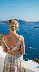 Woman enjoying sea view from cliffside terrace