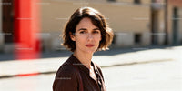 Thoughtful woman standing outdoors in natural daylight