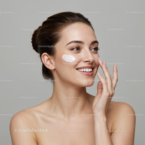 Young Woman Applying Moisturizer to Face for Healthy Glowing Skin