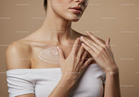 Close Up of Woman Applying Lotion to Shoulder for Skin Care