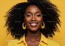 Smiling African Woman with Curly Hair and Bright Yellow Background