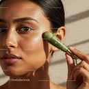 Close-Up of Woman Using Jade Roller for Facial Skincare