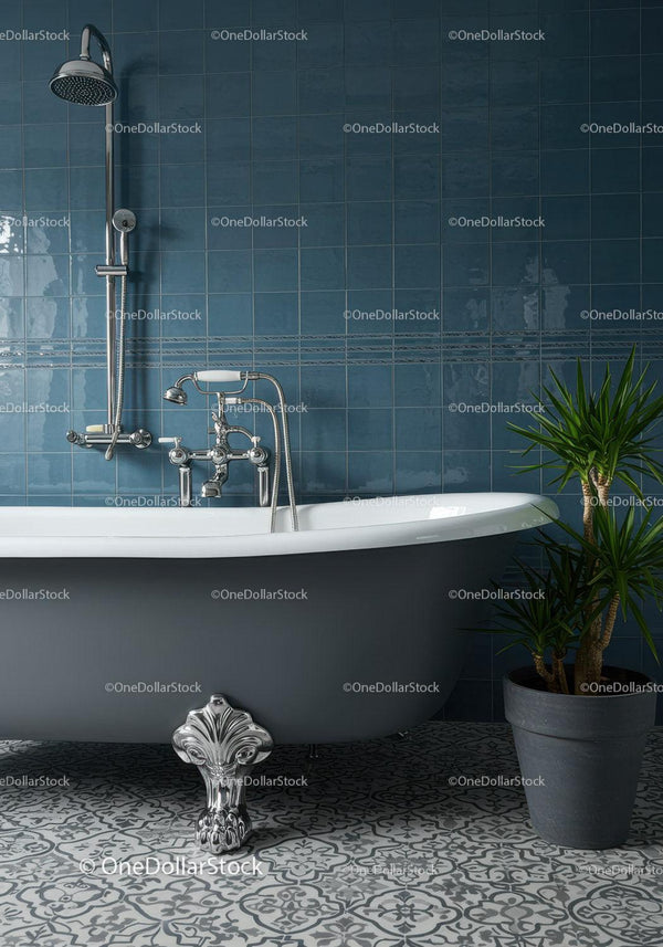 Gray clawfoot bathtub with contemporary blue tiles