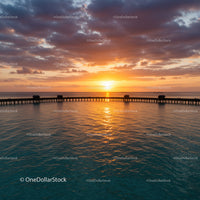 Beautiful Sunset Over Ocean Pier With Vibrant Sky in Tranquil Scene
