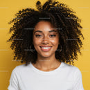 Vibrant Portrait of a Smiling Woman with Curly Hair Against Bright Yellow Background