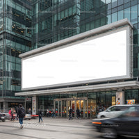 People walking in front of modern storefront with blank billboard