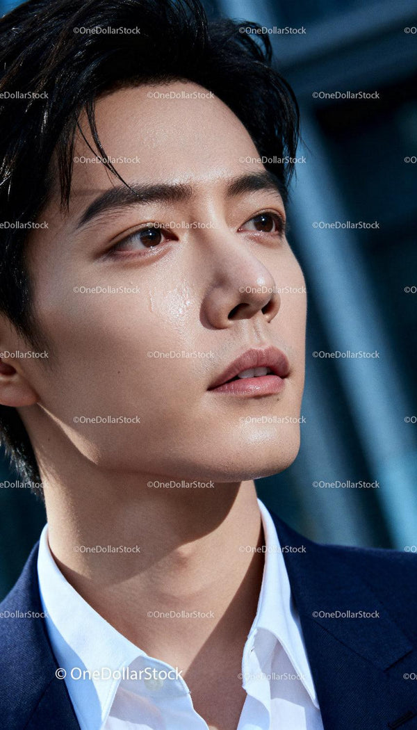 Close Up of Thoughtful Young Man with Natural Skin Glow