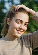 Joyful Young Woman Smiling Outdoors in Natural Light