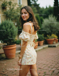 Young Woman in Floral Dress Smiling Outdoors in Garden