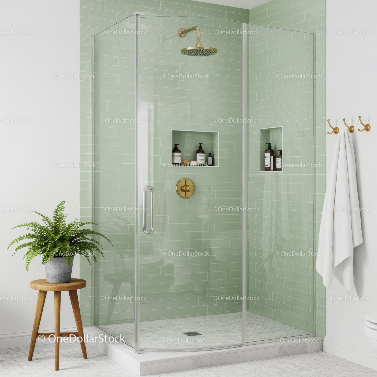 Modern glass shower with green tiles and brass fixtures