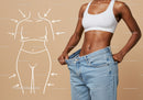 Slim Woman in White Sports Bra with Large Jeans Measuring Waist