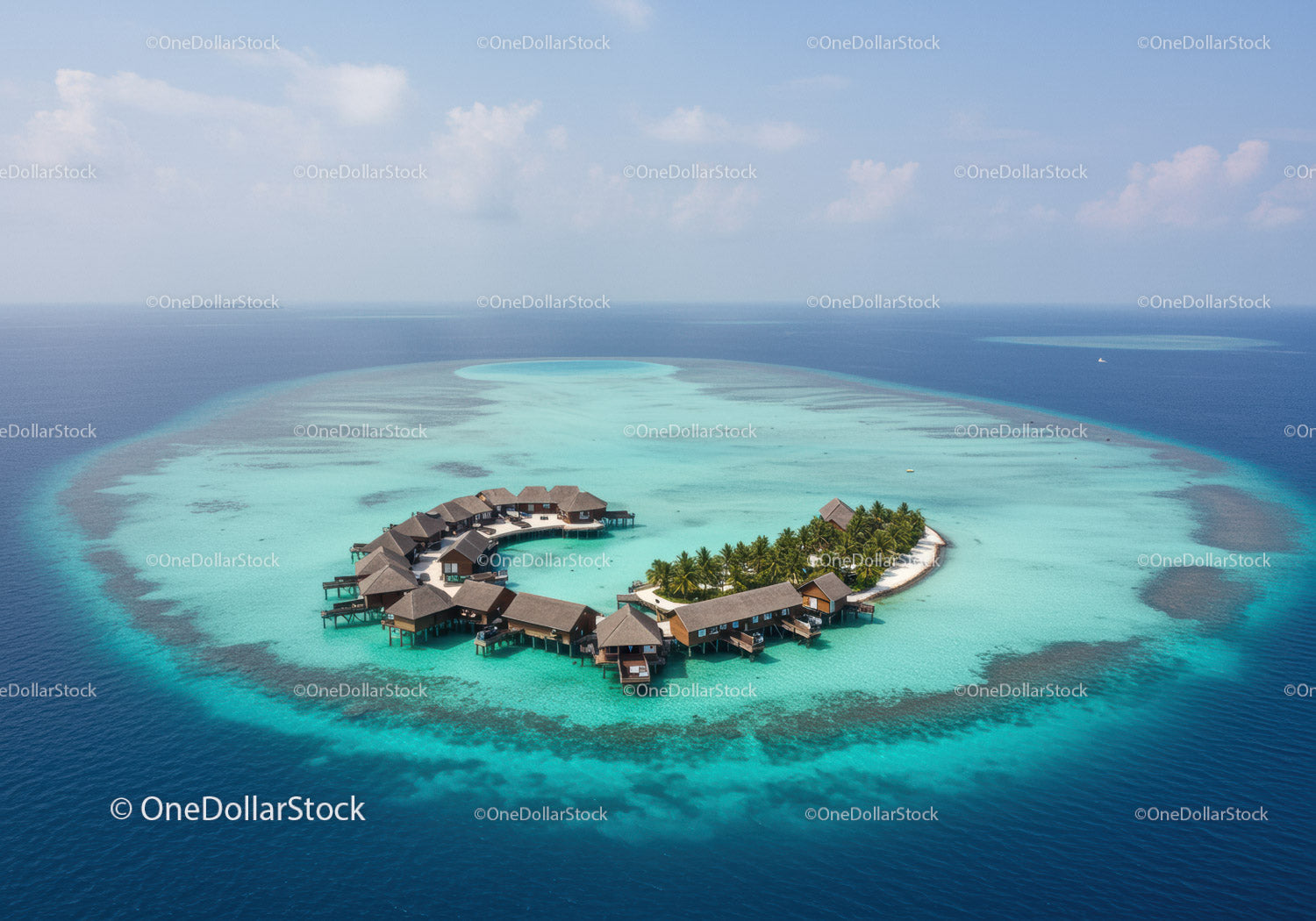 Overwater Bungalows on Tropical Island with Turquoise Waters