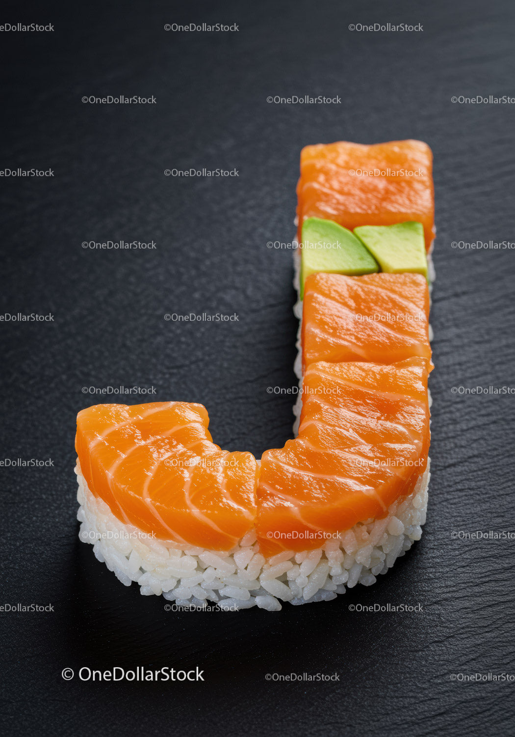 Sushi shaped like letter J with salmon and avocado
