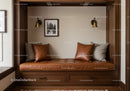 Cozy Built-in Window Bench with Leather Cushions and Decorative Lighting